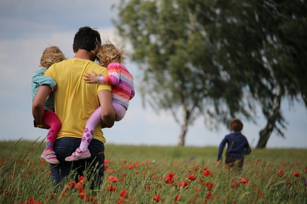 father kids in field